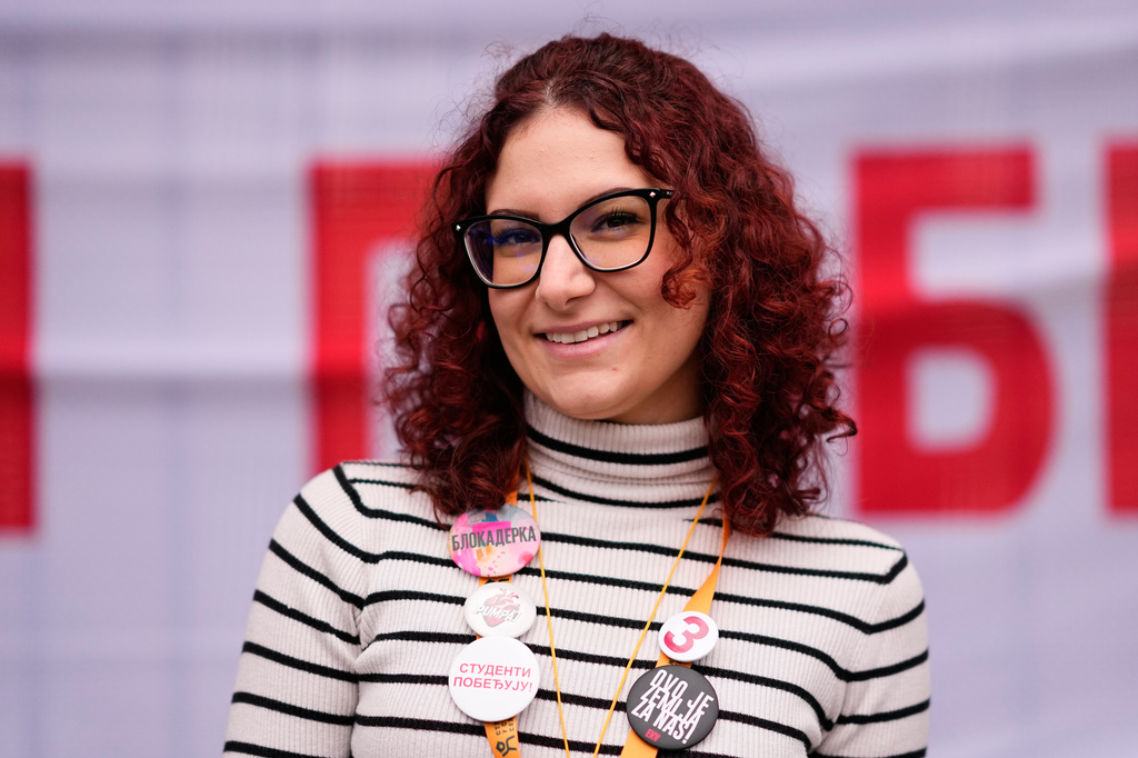 Mina Pejovic, student of pharmacy, from Belgrade, 26, poses for a photo ahead of the election in Belgrade, Serbia, Thursday, Oct. 22, 2026. (AP Photo/Petr David Josek)
