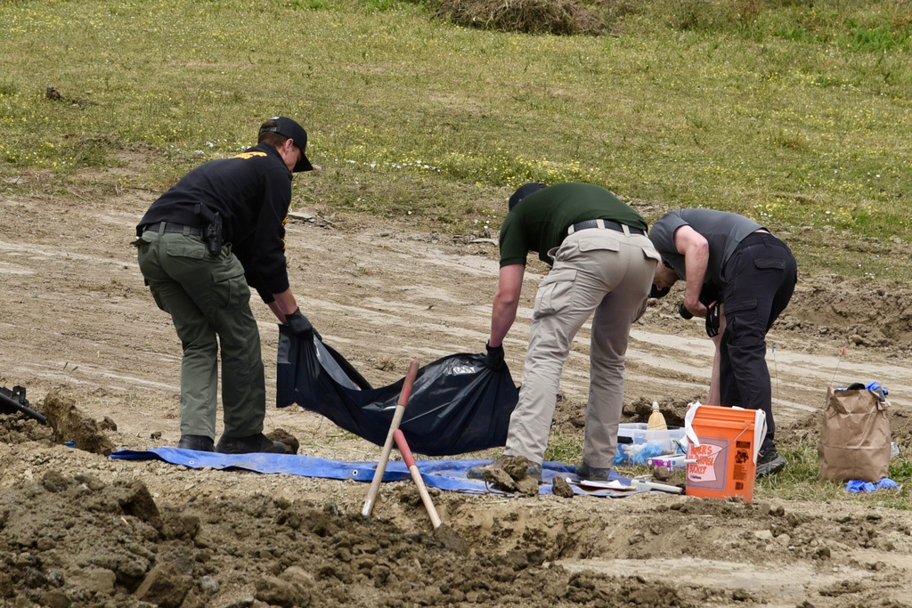 Investigators from the Humboldt County Sheriff's Office search the grounds of Miranda's Rescue Animal Sanctuary in Fortuna, Calif., June 24, 2026, where the remains of at least 117 dogs were found. (Ryan Burns/Lost Coast Outpost via P)