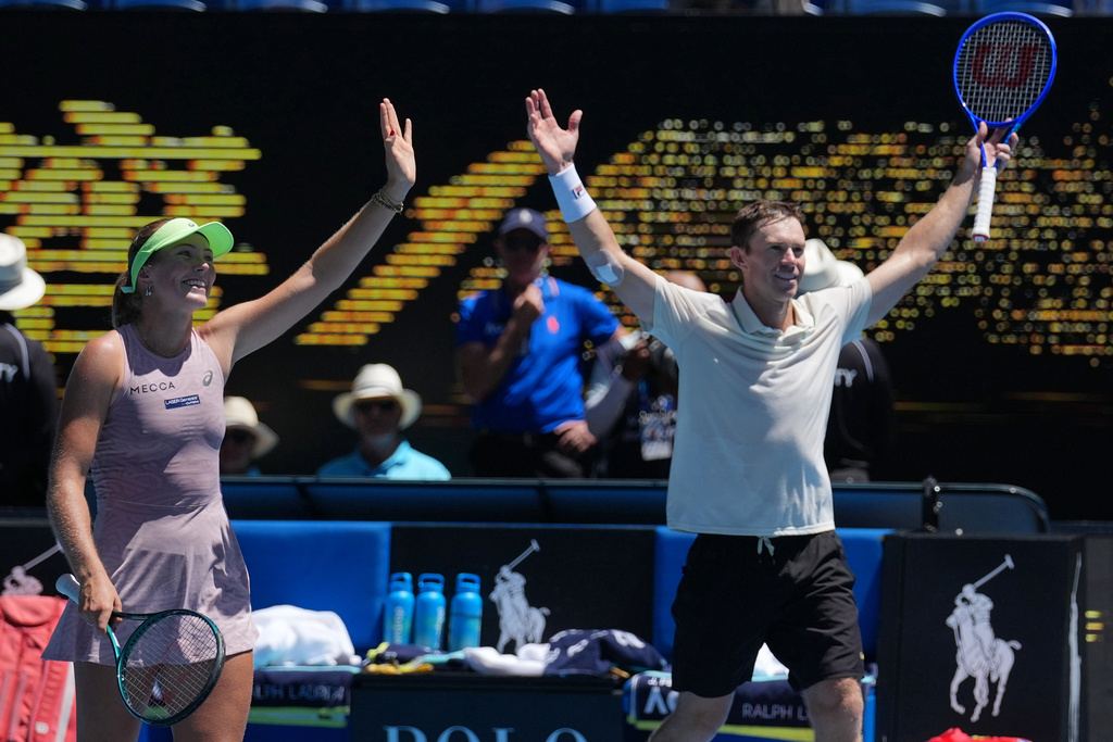 Australia's Olivia Gadecki and John Peers celebrate after defeating France's Kristina Mladenovic and Manuel Guinard in the mixed doubles final at the Australian Open tennis championship in Melbourne, Australia, Friday, Jan. 30, 2026. (AP Photo/Dita Alangkara)