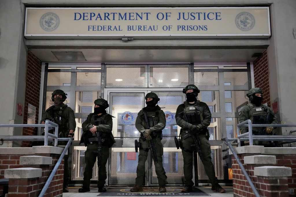 Federal law enforcement personnel stand watch outside the Metropolitan Detention Center as they await the arrival of captured Venezuelan President Nicolas Maduro, Saturday, Jan. 3, 2026, in New York. (AP Photo/Yuki Iwamura)
