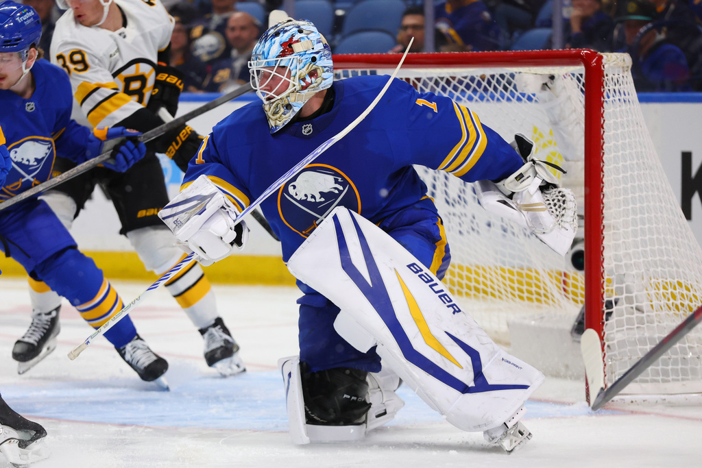 Buffalo Sabres goaltender Ukko-Pekka Luukkonen (1) watches the puck in traffic during the second period of an NHL hockey game against the Boston Bruins Wednesday, March 25, 2026, in Buffalo, N.Y. (AP Photo/Jeffrey T. Barnes)