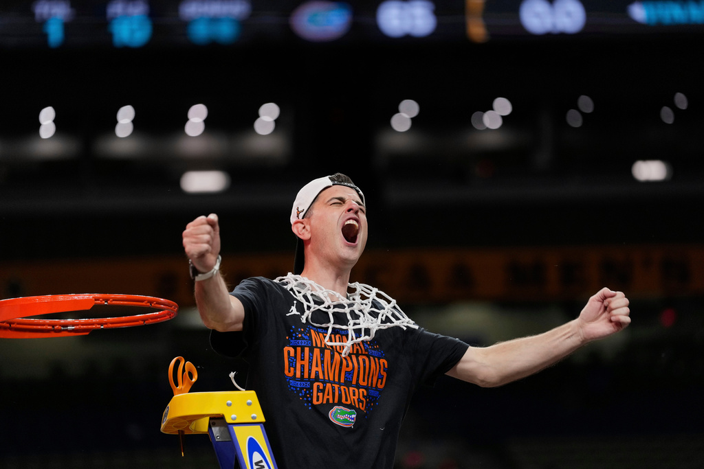 FILE - Florida head coach Todd Golden celebrates after his team defeated Houston in the national championship at the Final Four of the NCAA college basketball tournament April 7, 2025, in San Antonio. (AP Photo/Eric Gay, File)