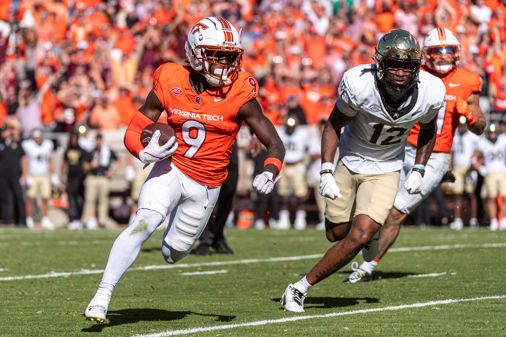 Virginia Tech cornerback Isaiah Brown-Murray (9) runs an interception back against Wake Forest during the second half of an NCAA college football game, Saturday, Oct. 4, 2025, in Blacksburg, Va. (AP Photo/Robert Simmons)