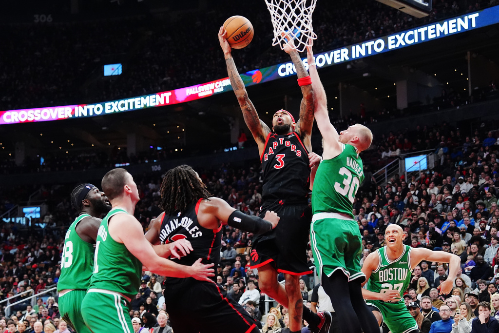 Toronto Raptors' Brandon Ingram (3) shoots over Boston Celtics' Sam Hauser (30) during first-half NBA basketball game action in Toronto, Saturday, Dec. 20, 2025. (Frank Gunn/The Canadian Press via AP)