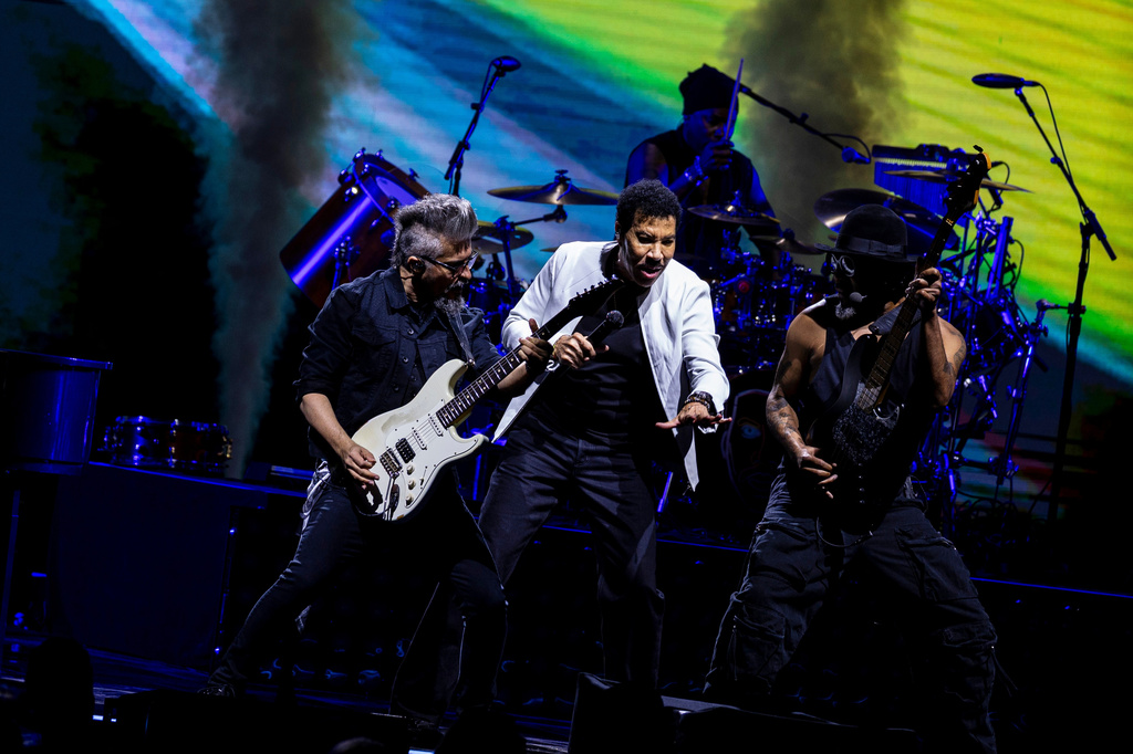 Lionel Richie, center, performs during the grand opening of Acrisure Amphitheater in downtown Grand Rapids, Mich. on Friday, May 15, 2026. (Joel Bissell/Kalamazoo Gazette via AP)