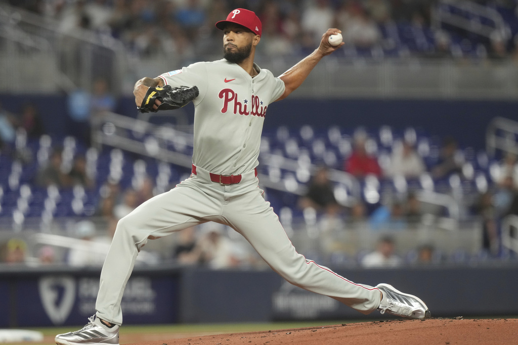 Philadelphia Phillies starting pitcher Cristopher Sánchez aims a pitch during the first inning of a baseball game against the Miami Marlins Friday, Sept. 5, 2025, in Miami. (AP Photo/Marta Lavandier)