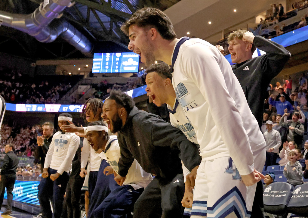 Rhode Island bench react after an under the net foul was called on Saint Louis during the second half of an NCAA college basketball game, Tuesday, Feb. 17, 2026, in South Kingstown, R.I. (AP Photo/Mark Stockwell)