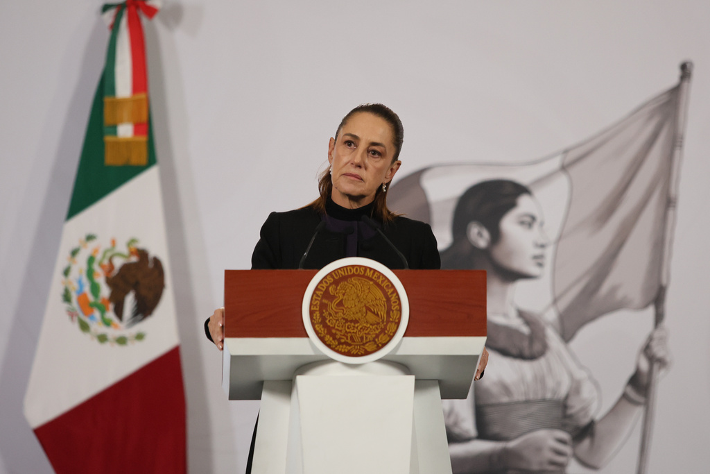 Mexican President Claudia Sheinbaum gives her the daily, morning news conference at the National Palace in Mexico City, Monday, Feb. 23, 2026, the day after the Mexican army killed Jalisco New Generation Cartel leader Nemesio Oseguera Cervantes, known as "El Mencho." (AP Photo/Ginnette Riquelme)