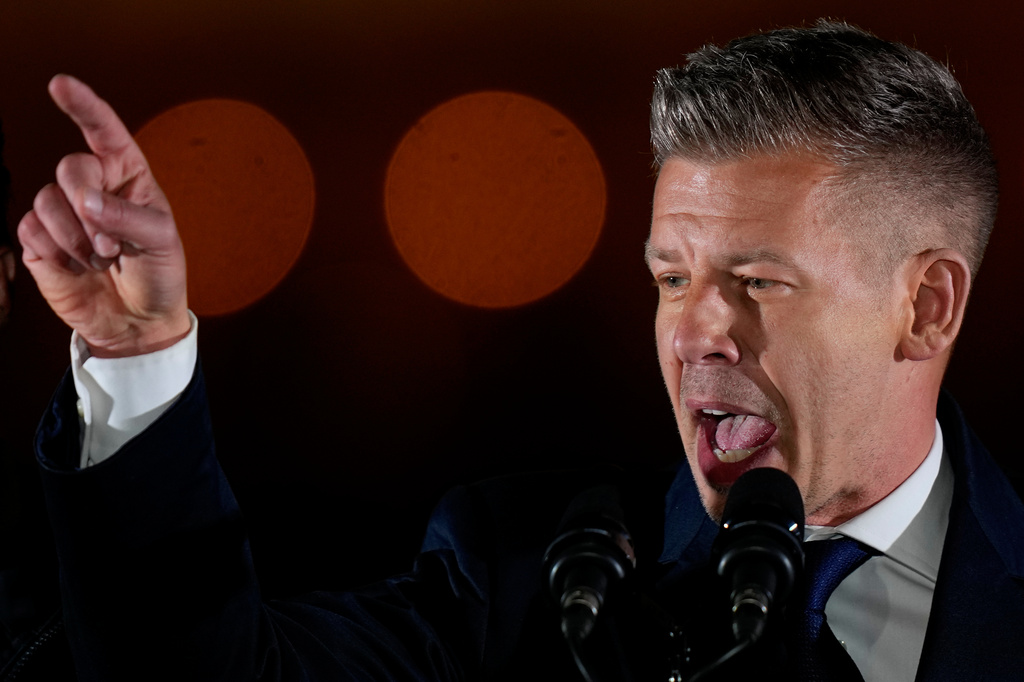 Peter Magyar, the leader of the opposition Tisza party addresses after claiming victory in a parliamentary election in Budapest, Hungary, Sunday, April 12, 2026. (AP Photo/Darko Bandic)