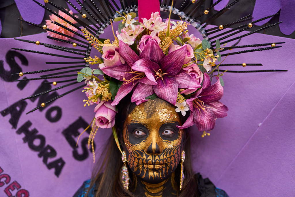 A woman takes part in an International Women's Day protest in Madrid, Spain, Sunday, March 8, 2026. (AP Photo/Manu Fernandez)