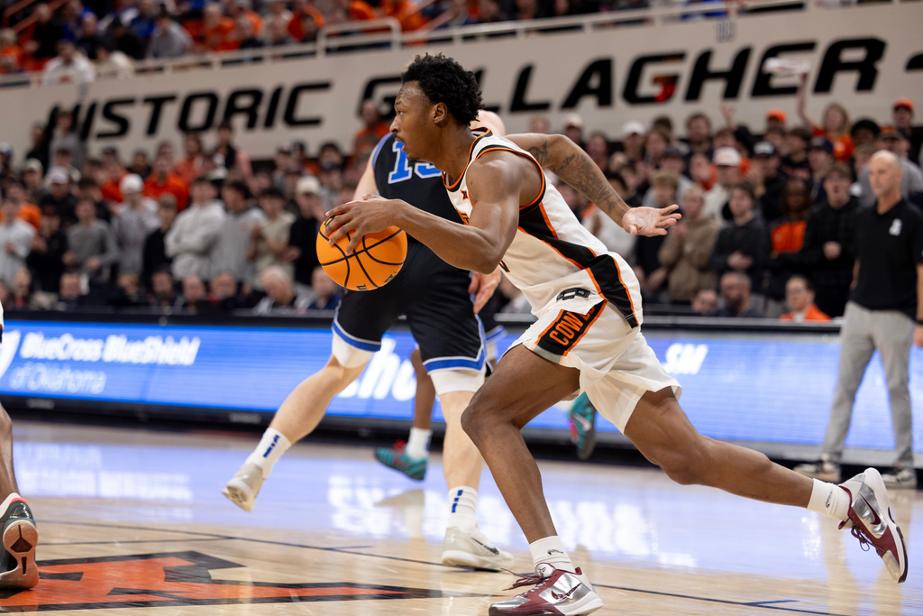Oklahoma State guard Anthony Roy (9) brings the ball up the court in the first half of an NCAA college basketball game against BYU, Wednesday, Feb. 4, 2026 in Stillwater, Okla. (AP Photo/Mitch Alcala)