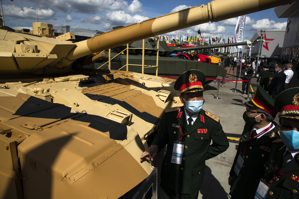 FILE - Military visitors from Vietnam observe the Russian T-90MS tank during the International Military Technical Forum Army-2020 in Alabino, outside Moscow, Russia, on Aug. 23, 2020. (AP Photo/Pavel Golovkin, File)