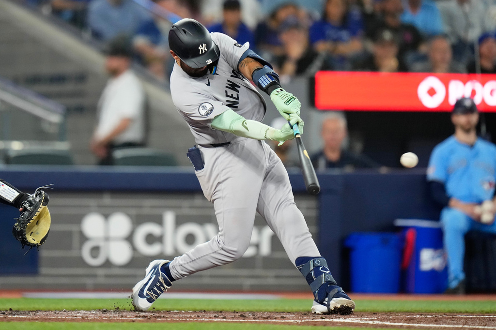 New York Yankees' Ali Sánchez hits a RBI double off Toronto Blue Jays pitcher Patrick Corbin during the second inning of a baseball game in Toronto on Sunday June 14, 2026. (Chris Young/The Canadian Press via AP)