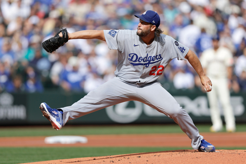 Los Angeles Dodgers pitcher Clayton Kershaw throws against the Seattle Mariners during a baseball game, Sunday, Sept. 28, 2025, in Seattle. (AP Photo/John Froschauer)