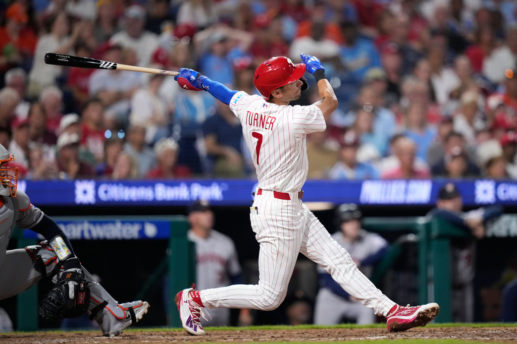 Philadelphia Phillies' Trea Turner follows through after hitting a two-run home run against Houston Astros pitcher Hayden Wesneski during the sixth inning of a baseball game Tuesday, Sept. 8, 2026, in Philadelphia. (AP Photo/Matt Slocum)