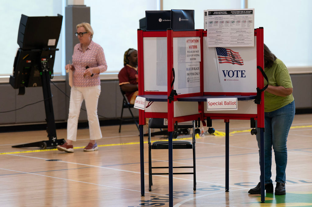 People cast their vote during D.C. primary election at Shepard Park Elementary, Tuesday, June 16, 2026, in Washington. (AP Photo/Jose Luis Magana)