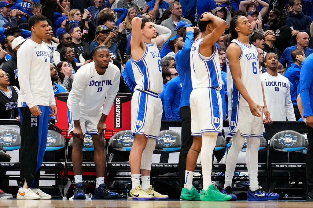 Duke players react to their loss against UConn in the Elite Eight of the NCAA college basketball tournament, Sunday, March 29, 2026, in Washington. (AP Photo/Abbie Parr)