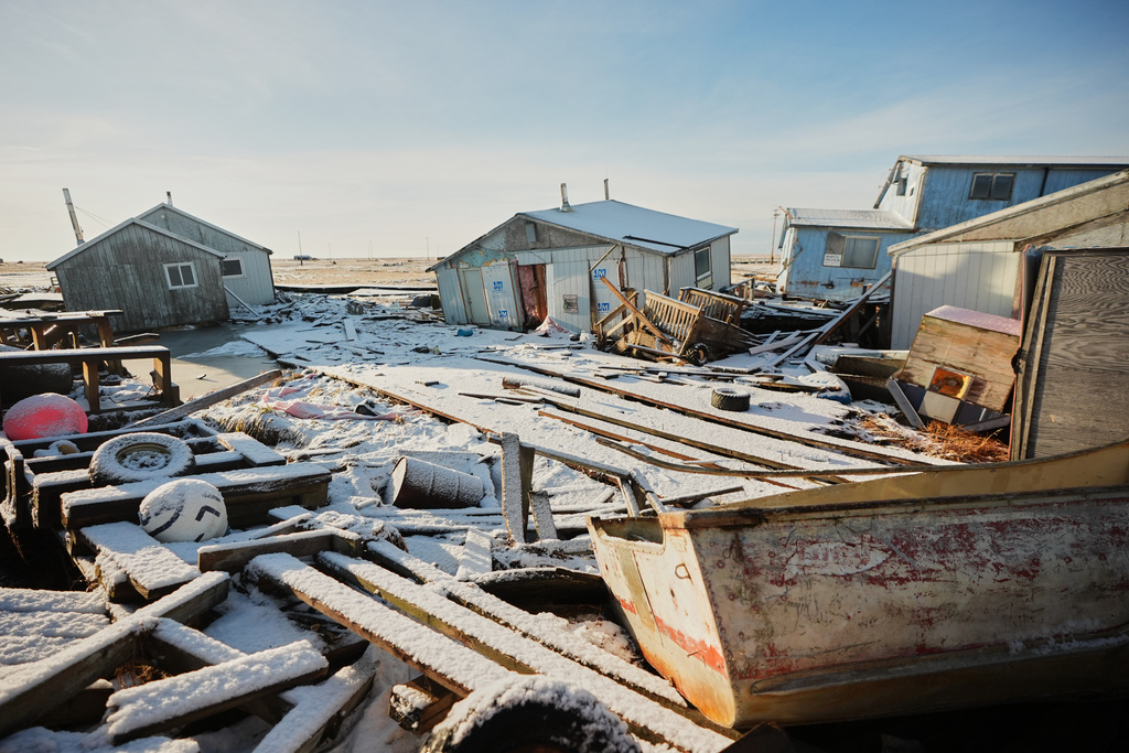 Homes are surrounded by debris in Kwigillingok, Alaska, Monday, Oct. 27, 2025, after being damaged earlier in the month by Typhoon Halong. (AP Photo/Lindsey Wasson)