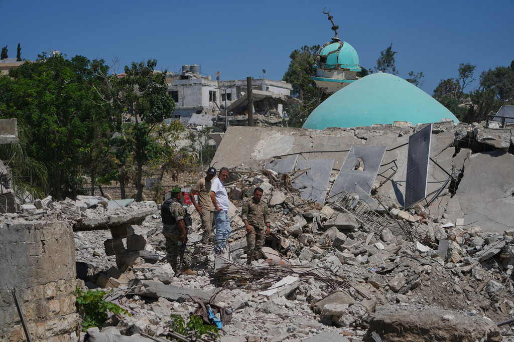 Lebanese soldiers and a resident inspect the rubble of a home destroyed during an Israeli military operation in Zawtar al-Gharbieh, southern Lebanon, Tuesday, July 28, 2026. (AP Photo/Hassan Ammar)