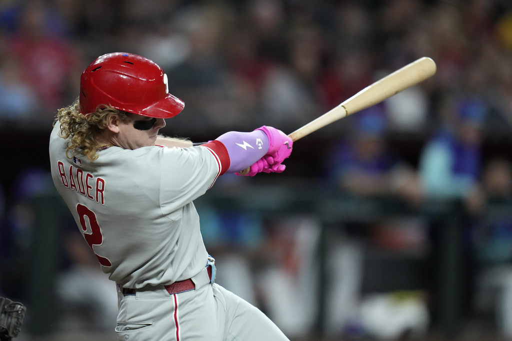 Philadelphia Phillies' Harrison Bader connects for a home run against the Arizona Diamondbacks during the fifth inning of a baseball game Friday, Sept. 19, 2025, in Phoenix. (AP Photo/Ross D. Franklin)