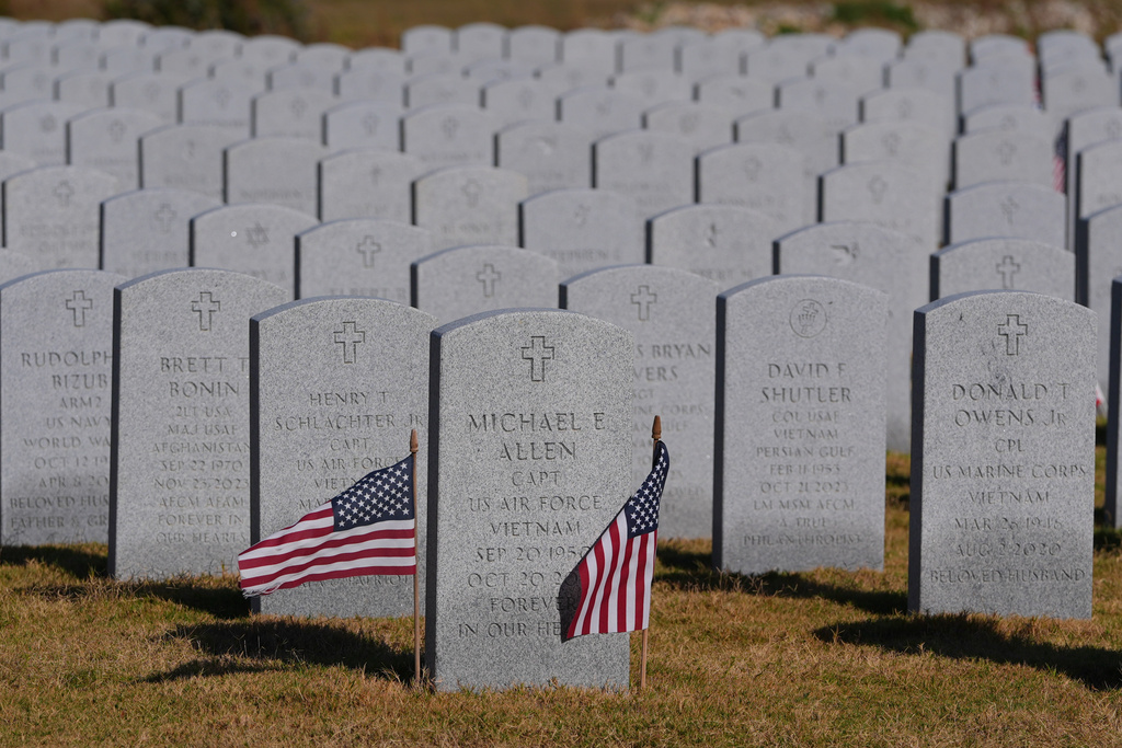 Grave markers of U.S. veterans are shown at the Dallas-Fort Worth National Cemetery where the upcoming annual Veterans Day program has been canceled due to the federal government shutdown in Dallas, Tuesday, Nov. 4, 2025. (AP Photo/LM Otero)