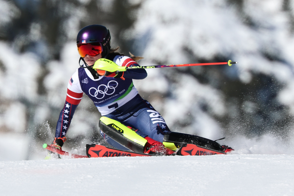 United States' Mikaela Shiffrin speeds down the course during an alpine ski, women's slalom race, at the 2026 Winter Olympics, in Cortina d'Ampezzo, Italy, Wednesday, Feb. 18, 2026. (AP Photo/Marco Trovati)
