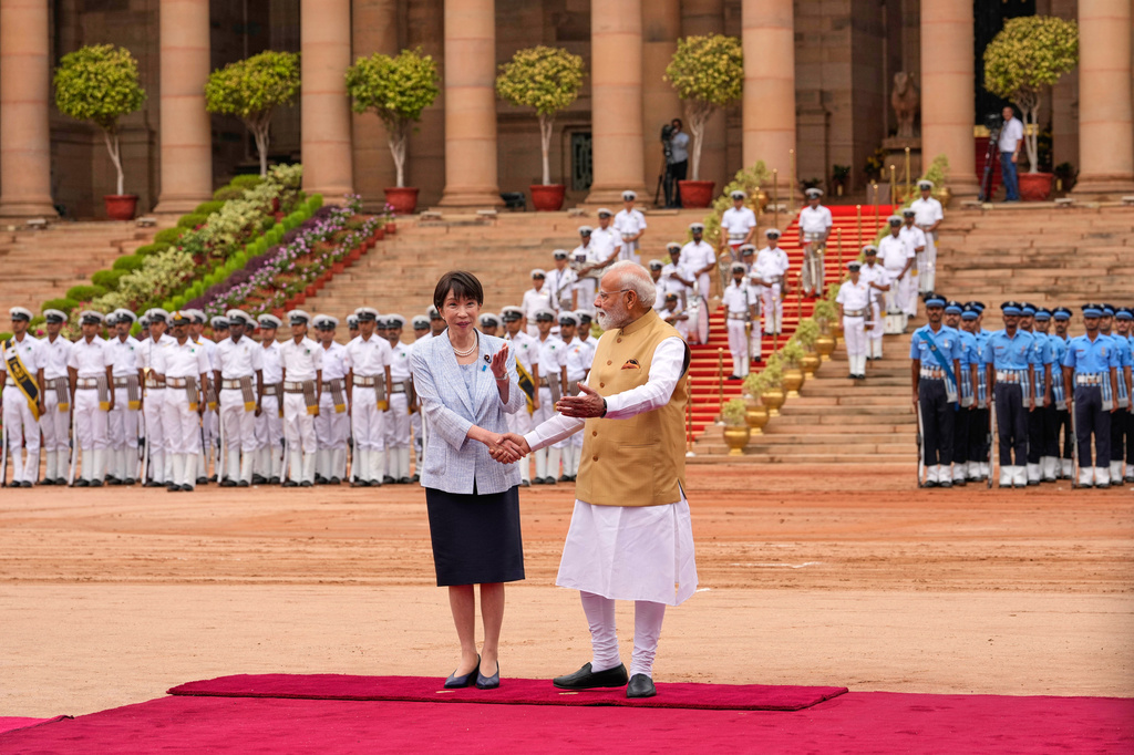 Indian Prime Minister Narendra Modi, right, shakes hand with his Japanese counterpart Sanae Takaichi during her ceremonial reception at the Indian presidential palace in New Delhi, India, Thursday, July 2, 2026. (AP Photo/Manish Swarup)