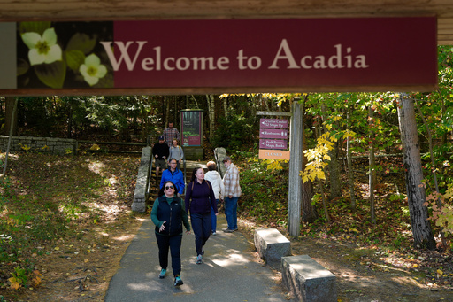 Visitors walk back to the parking lot after discovering the visitor center, park store and restrooms are closed at Acadia National Park, Wednesday, Oct. 1, 2025, in Maine. (AP Photo/Robert F. Bukaty) Visitors walk back to the parking lot after discovering the visitor center, park store and restrooms are closed at Acadia National Park, Wednesday, Oct. 1, 2025, in Maine. (AP Photo/Robert F. Bukaty)