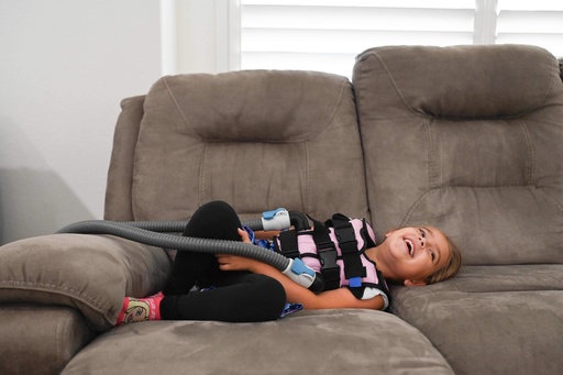 Amelia Bittner, 6, uses her vibrating CPT vest at her home on Wednesday, Oct. 29, 2025, in Pflugerville, Texas. (AP Photo/Jack Myer) Amelia Bittner, 6, uses her vibrating CPT vest at her home on Wednesday, Oct. 29, 2025, in Pflugerville, Texas. (AP Photo/Jack Myer)