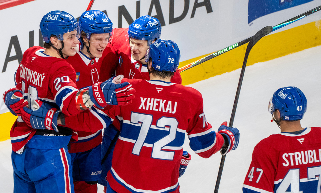 Montreal Canadiens' Oliver Kapanen (91) celebrates his goal over Florida Panthers with teammates Juraj Slafkovsky (20), Ivan Demidov (93), Arber Zhekaj (72) and Jayden Struble (47) during the first period of an NHL hockey game in Montreal, Thursday, Jan. 8, 2026. (Christinne Muschi/The Canadian Press via AP)