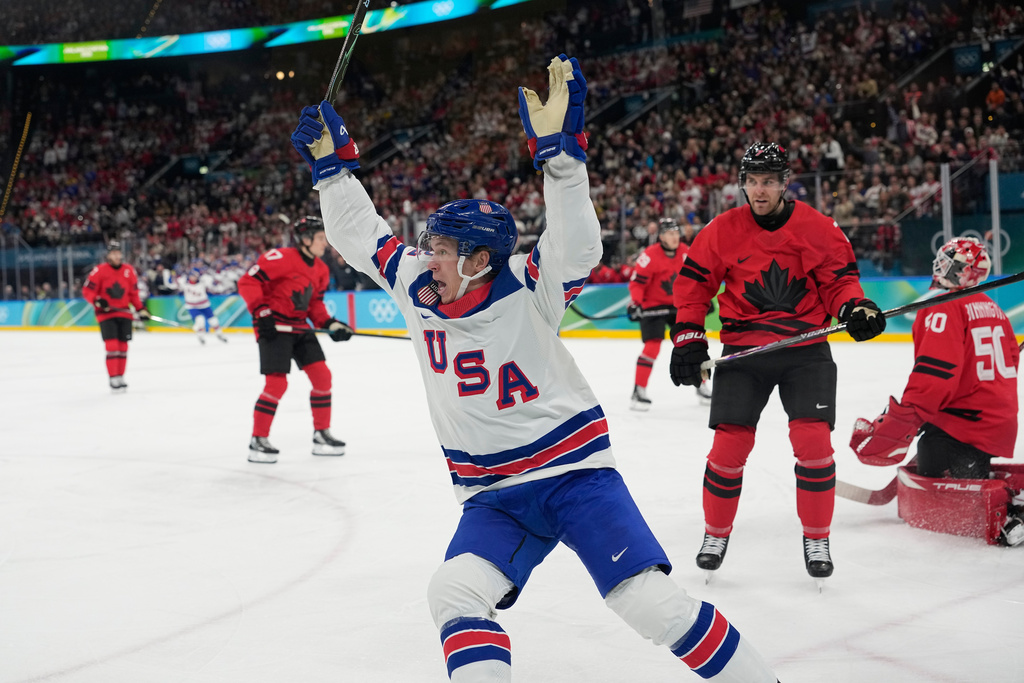 United States' Matt Boldy, center, celebrates after scoring the opening goal during a men's ice hockey gold medal game between Canada and the United States at the 2026 Winter Olympics, in Milan, Italy, Sunday, Feb. 22, 2026. (AP Photo/Hassan Ammar)