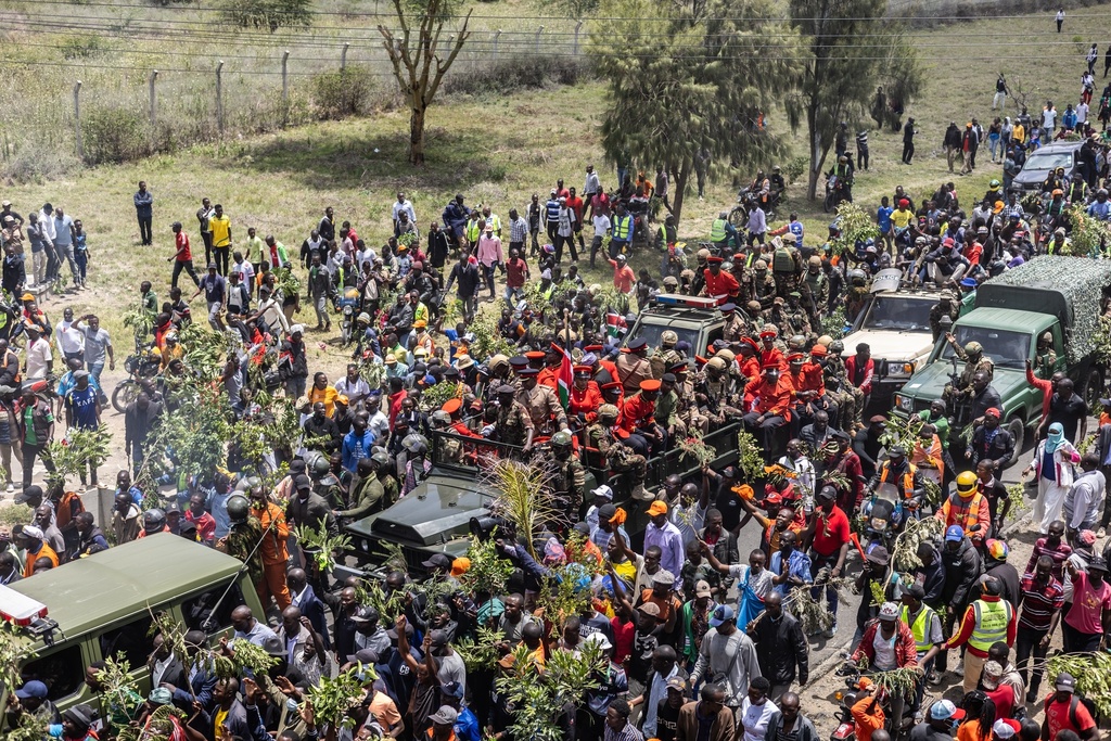 Mourners gather for the arrival of the body of Kenya's former Prime Minister Raila Odinga arrives in Nairobi, Kenya, a day after he died in India, Thursday, Oct. 16, 2025. (AP Photo/Samson Otieno)