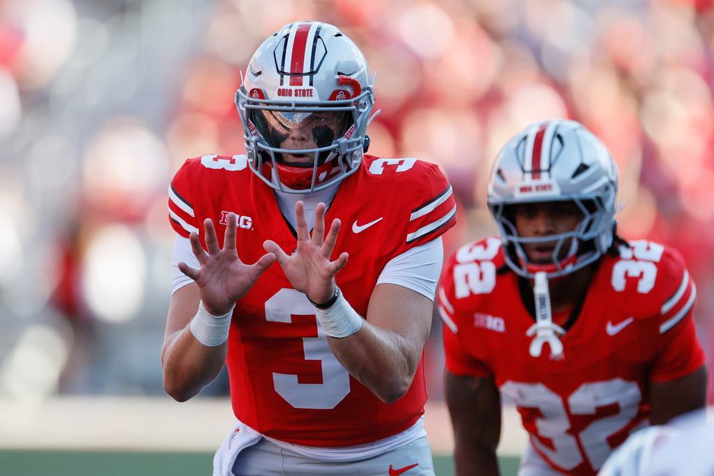Ohio State quarterback Lincoln Kienholz takes a snap against Grambling State during the second half of an NCAA college football game, Saturday, Sept. 6, 2025, in Columbus, Ohio. (AP Photo/Jay LaPrete)