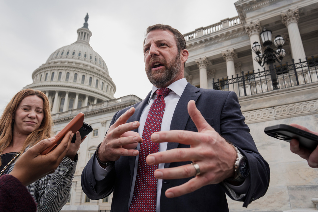 FILE - Sen. Markwayne Mullin, R-Okla., speaks with reporters on the steps at the Capitol in Washington, Thursday, March 5, 2026. (AP Photo/J. Scott Applewhite, File)