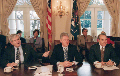FILE - President Bill Clinton, center, meets with House Speaker Newt Gingrich, R-Ga., left, and Senate Majority Leader Bob Dole, R- Kansas, to grapple with competing balanced budget plans, Dec. 31, 1995, at the White House in Washington (AP Photo/Greg Gibson, File) FILE - President Bill Clinton, center, meets with House Speaker Newt Gingrich, R-Ga., left, and Senate Majority Leader Bob Dole, R- Kansas, to grapple with competing balanced budget plans, Dec. 31, 1995, at the White House in Washington (AP Photo/Greg Gibson, File)
