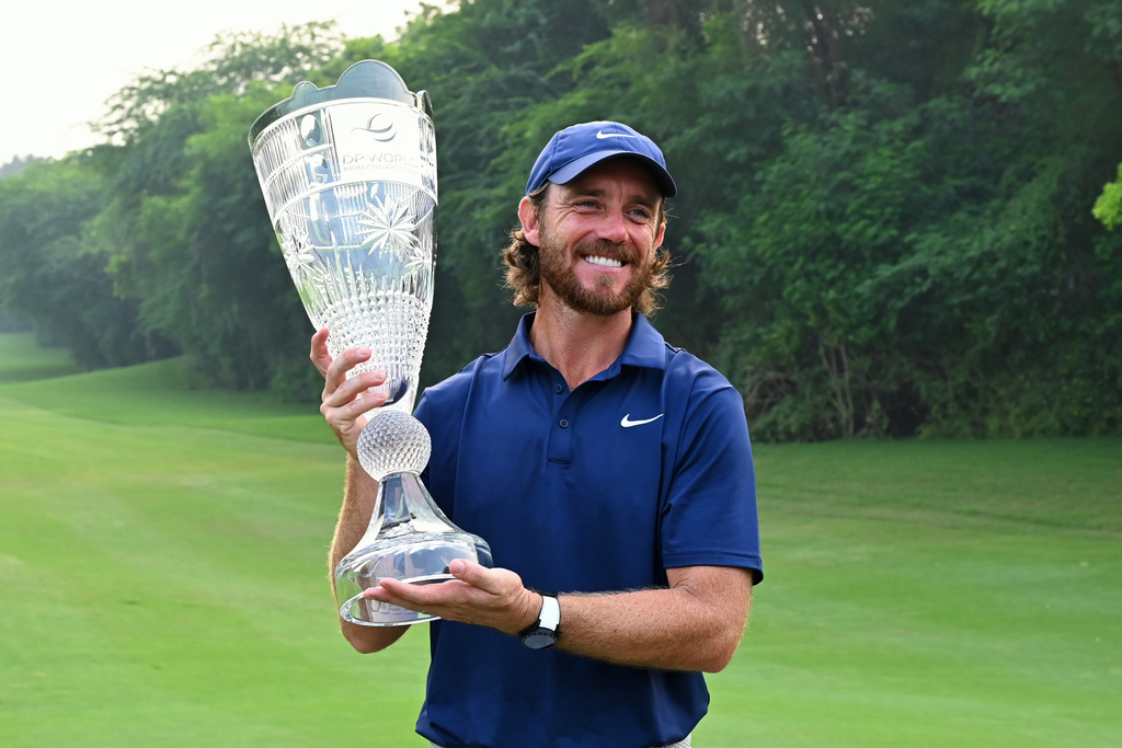 Tommy Fleetwood of England poses with the trophy after wining the DP World Tour Championship golf tournament in New Delhi, India, Sunday, Oct.19, 2025. (AP Photo/Dharam Diwakar)