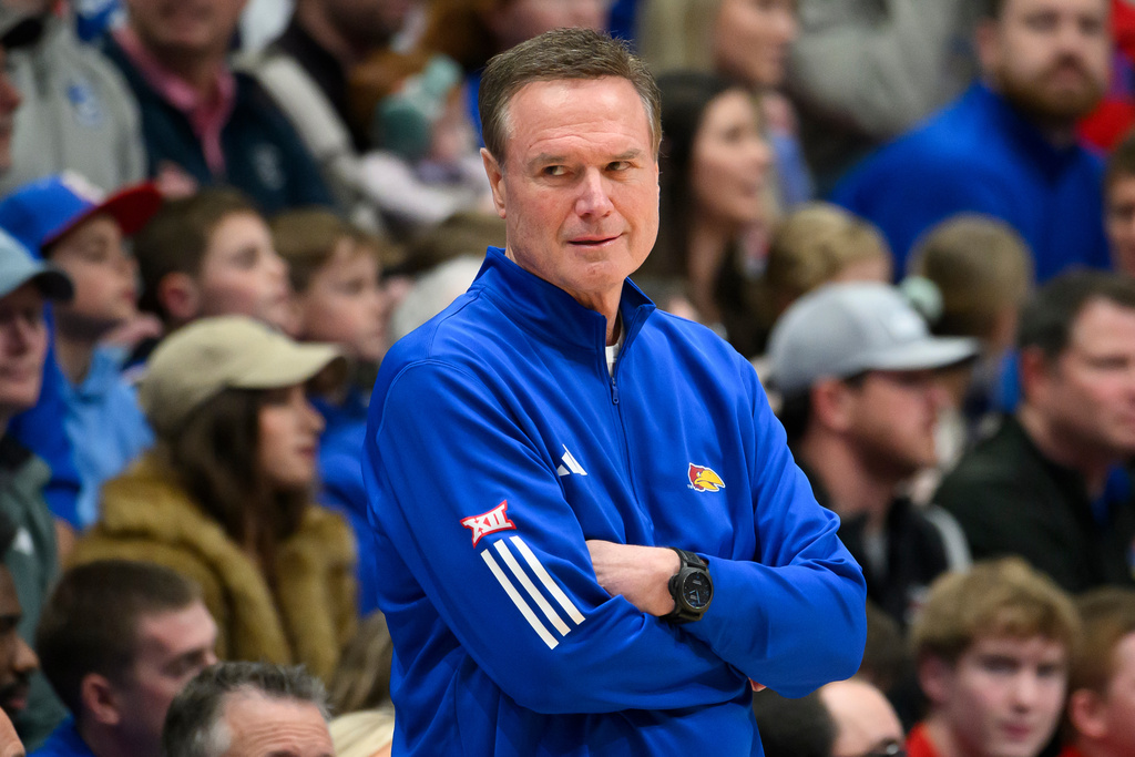 Kansas head coach Bill Self watches his team play against Utah in the first half of an NCAA college basketball game in Lawrence, Kan., Saturday, Feb. 7, 2026. (AP Photo/Reed Hoffmann)