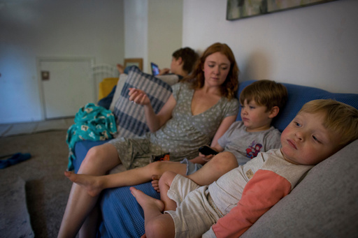 Taylor Moyer, center with her children Liam, from left, Colton, and Bradley at home, Sunday, Oct. 5, 2025, in Virginia Beach, Va. (AP Photo/John Clark) Taylor Moyer, center with her children Liam, from left, Colton, and Bradley at home, Sunday, Oct. 5, 2025, in Virginia Beach, Va. (AP Photo/John Clark)