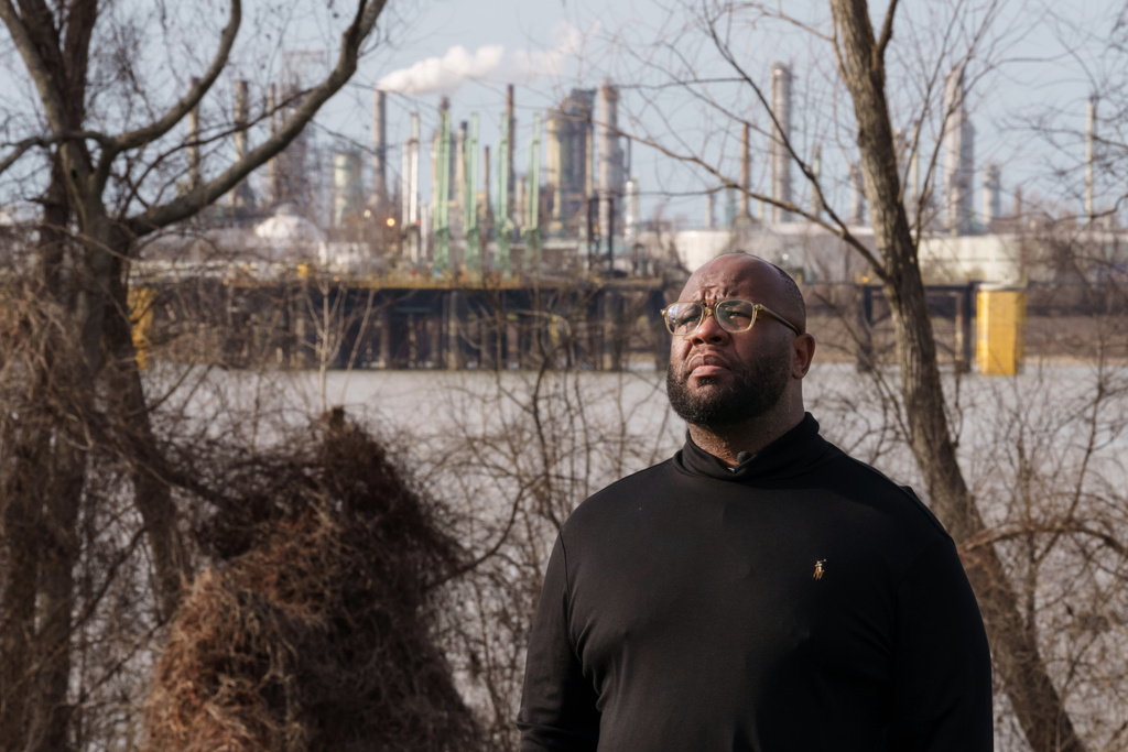 Gary C. Watson, Jr., who was born and raised in St. John the Baptist Parish, poses for a photo in Edgard, La., Wednesday, Feb. 18, 2026, across the river from a Marathon Petroleum Refinery. (AP Photo/Matthew Hinton)