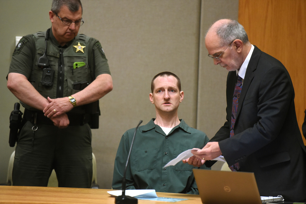Robert Tulloch, sitting, waits for his resentencing to start with his attorney Richard Guerriero on Monday, July 13, 2026, in Grafton Superior Court in North Haverhill, N.H. (Jennifer Hauck/Valley News via AP, Pool)