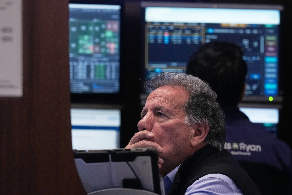 Trader Sal Suarino works on the floor of the New York Stock Exchange, Monday, Jan. 12, 2026. (AP Photo/Richard Drew)