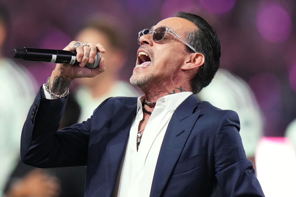 FILE - Marc Anthony performs the national anthem before an MLS soccer match between Inter Miami CF and Austin FC in Miami, April 4, 2026. (AP Photo/Lynne Sladky, File)