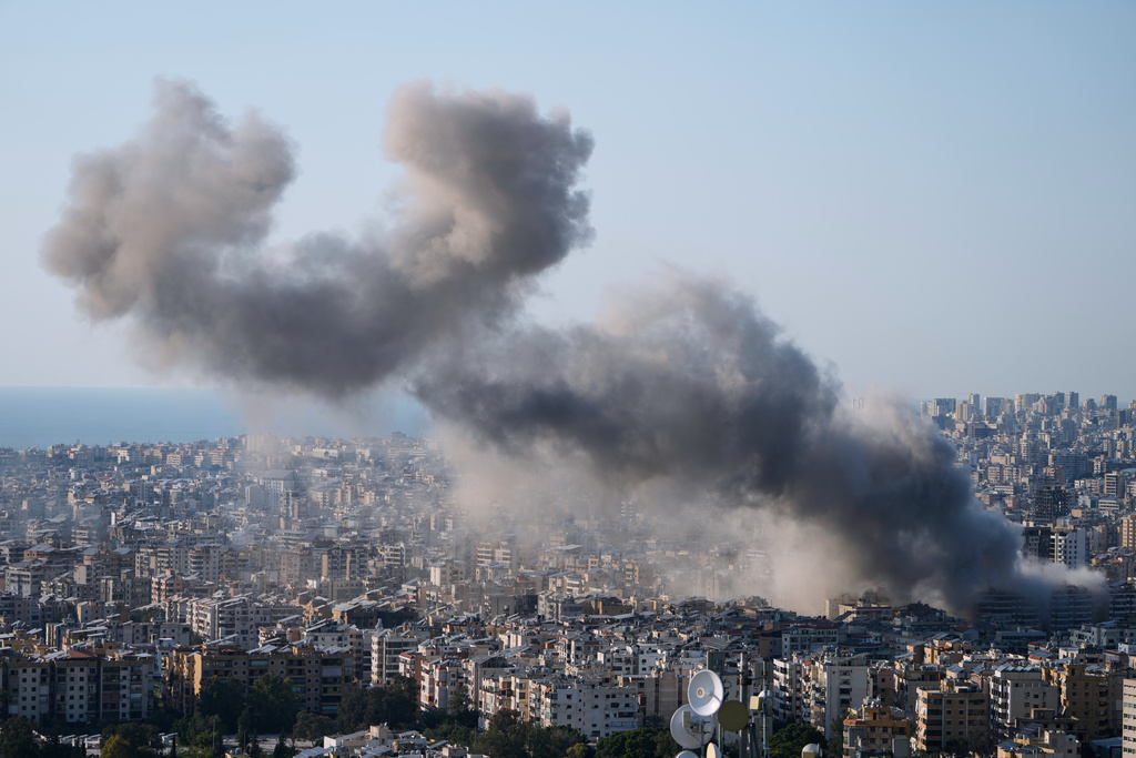 Smoke rise from an Israeli airstrike in Dahiyeh, Beirut's southern suburbs, Lebanon, Tuesday, March 10, 2026. (AP Photo/Bilal Hussein)