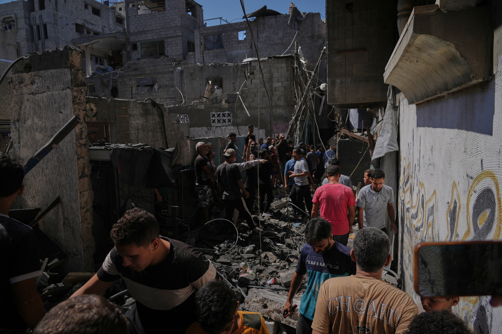 Palestinians inspect a building destroyed in an Israeli airstrike in Gaza City, Wednesday, Sept. 9, 2026. (AP Photo/Jehad Alshrafi)