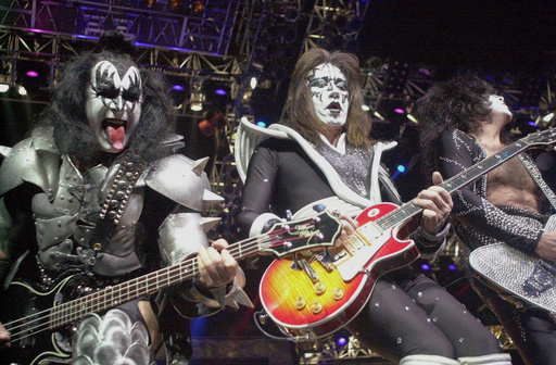 FILE - Kiss guitarist Paul Stanley, right, guitarist Ace Frehley, center, and bassist Gene Simmons play during the band's farewell concert in the Detroit area, Thursday, May 25, 2000, at the Palace of Auburn Hills, Mich.. (AP Photo/Paul Warner, File) FILE - Kiss guitarist Paul Stanley, right, guitarist Ace Frehley, center, and bassist Gene Simmons play during the band's farewell concert in the Detroit area, Thursday, May 25, 2000, at the Palace of Auburn Hills, Mich.. (AP Photo/Paul Warner, File)