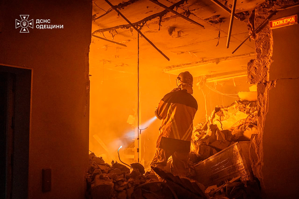 In this photo provided by the Ukrainian Emergency Service, an emergency services personnel works to extinguish a fire following a Russian air attack in Odesa, Ukraine, Thursday, Sept. 17, 2026. (Ukrainian Emergency Service via AP)