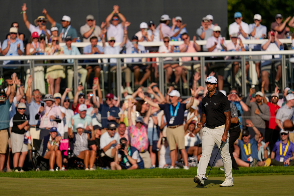 Aaron Rai, of England, celebrates after his shot on the 17th green during the final round of the PGA Championship golf tournament at Aronimink Golf Club, Sunday, May 17, 2026, in Newtown Square, PA. (AP Photo/Carolyn Kaster)