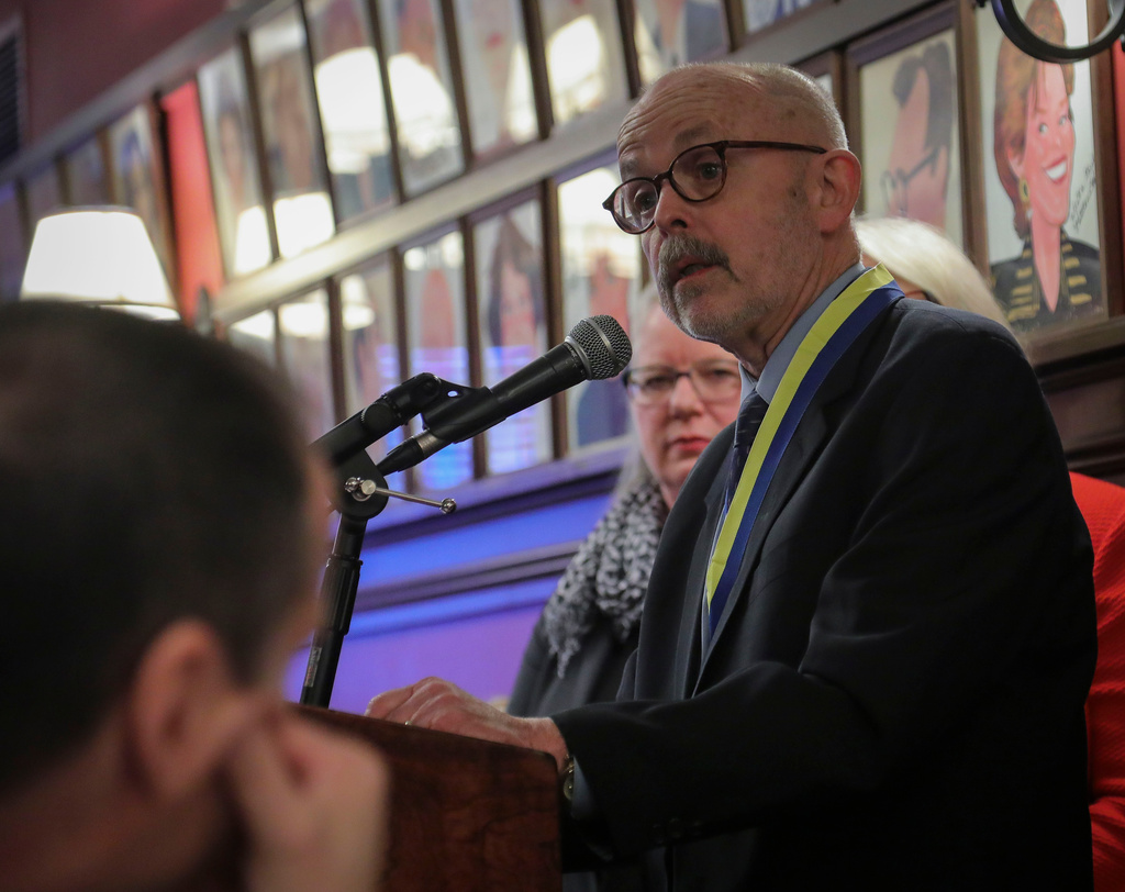 FILE - Associated Press photojournalist and Pulitzer Prize winner Richard Drew delivers remarks after his induction into The Deadline Club Hall of Fame, Thursday Nov. 21, 2019, in New York. (AP Photo/Bebeto Matthews)