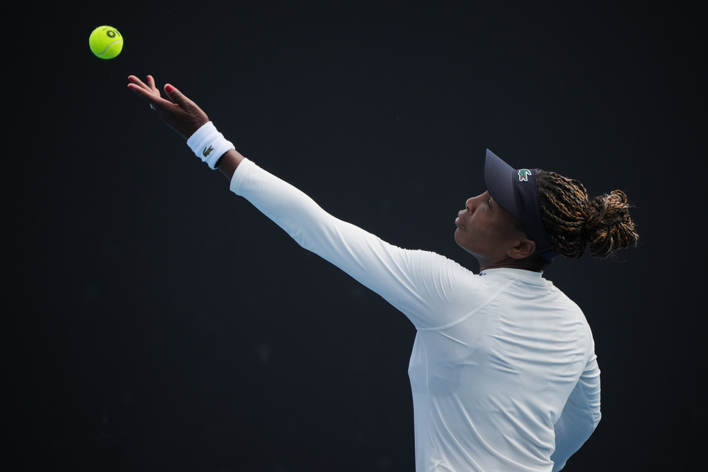 Venus Williams of the United States serves during a practice session ahead of the Australian Open tennis championship in Melbourne, Australia, Friday, Jan. 16, 2026. (AP Photo/Dita Alangkara)
