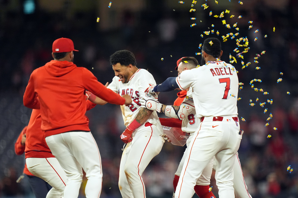 Los Angeles Angels Jose Siri celebrates with teammates after his game-winning single against the Houston Astros during the tenth inning of a baseball game, Wednesday, June 10, 2026, in Anaheim, Calif. (AP Photo/Scott Strazzante)